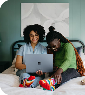 Two people sitting with tablet
